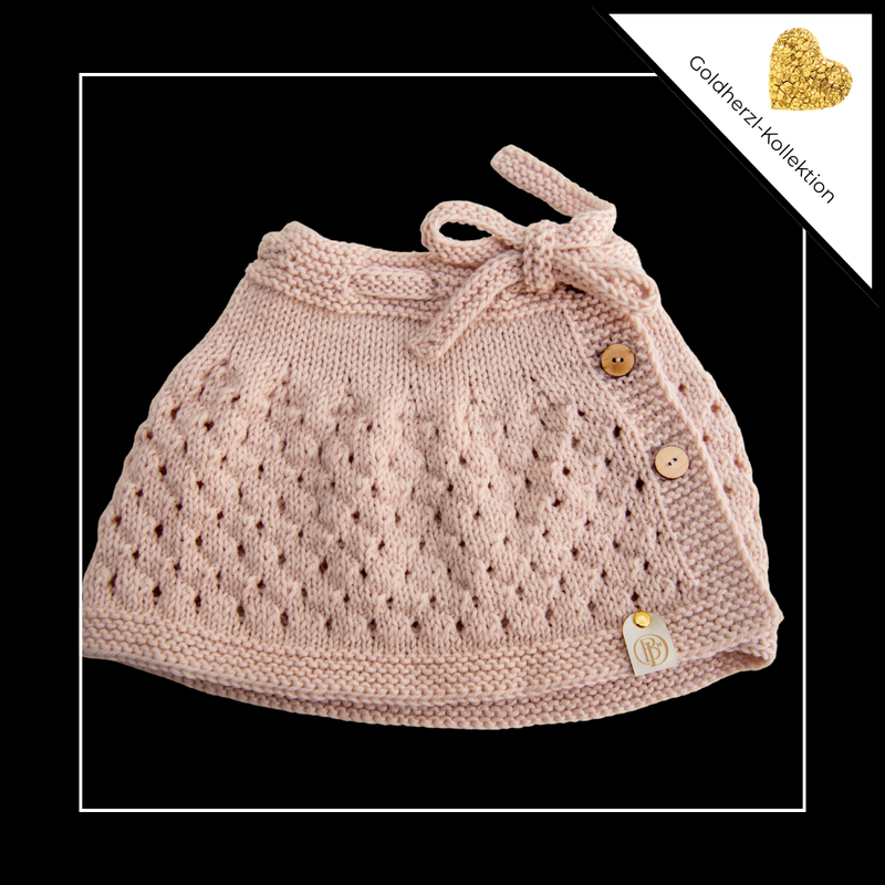 Goldherzl – handgestrickter Baby-Rock aus feinster Bio-Merinowolle
